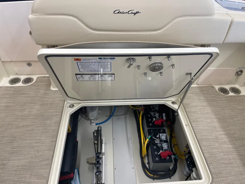 Slide: The Image of 2024 Chris-Craft Calypso 32 boat battery compartment with open hatch. - 8