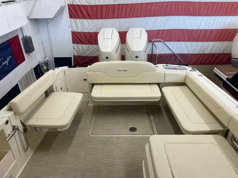 Slide: The Image of 2024 Chris-Craft Calypso 32 boat interior with seating and twin engines. - 9