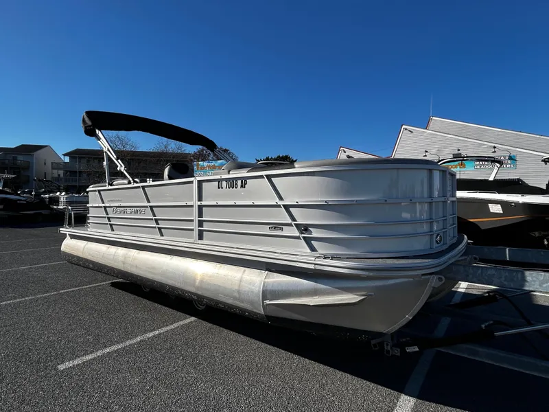 Slide: The Image of 2024 Berkshire 22RFX LE 2.75 pontoon boat in a parking lot. - 3