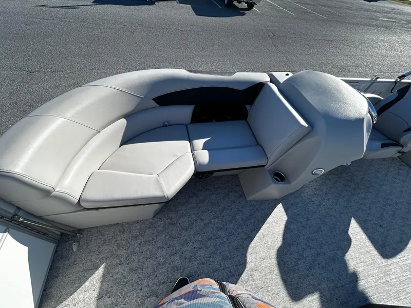 Slide: The Image of 2024 Berkshire 22RFX LE 2.75 boat interior with gray seating and helm. - 9