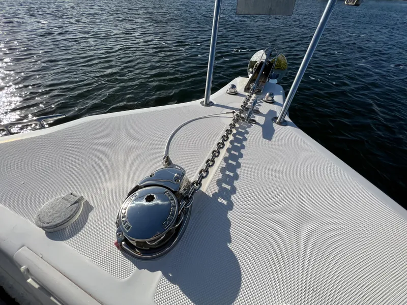 Slide: The Image of 2005 Century 3200 Walk-Around boat deck with anchor chain and winch. - 14