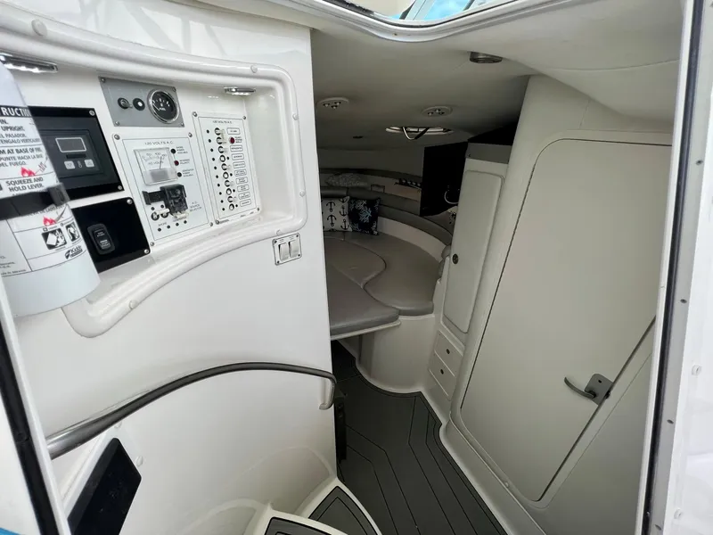 Slide: The Image of Interior of 2005 Century 3200 Walk-Around boat, featuring control panel and seating area. - 29
