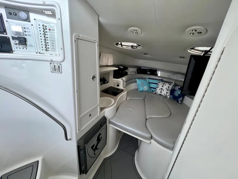 Slide: The Image of Interior of 2005 Century 3200 Walk-Around boat with cozy seating and modern amenities. - 30