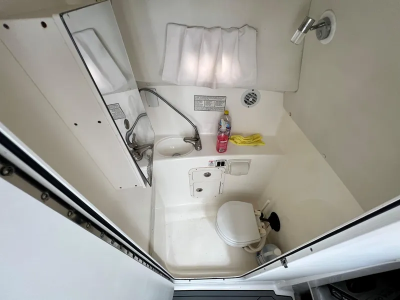 Slide: The Image of 2005 Century 3200 Walk-Around boat bathroom with shower and toilet. - 32