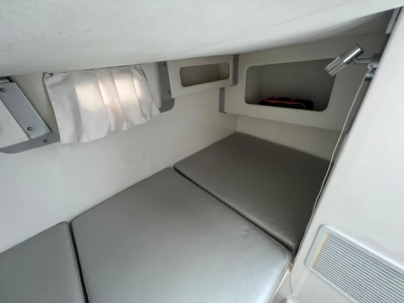 Slide: The Image of Interior cabin of 2005 Century 3200 Walk-Around boat with cushioned seating. - 40