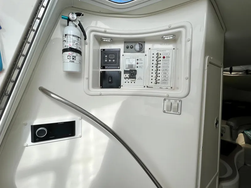 Slide: The Image of Control panel inside 2005 Century 3200 Walk-Around boat with fire extinguisher. - 41