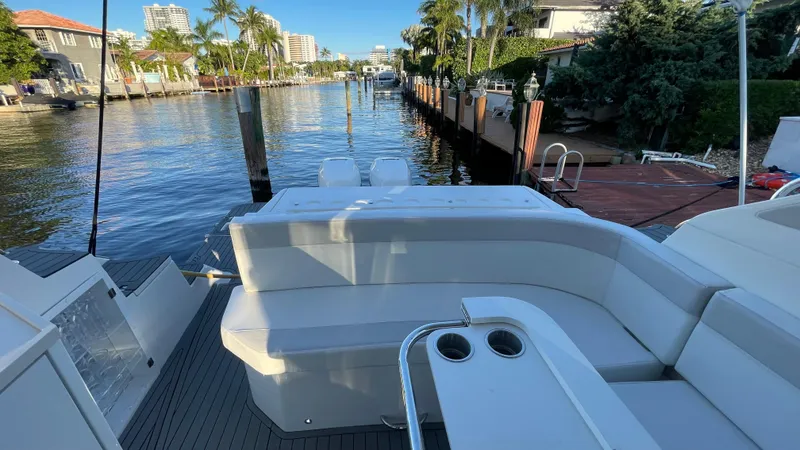 Slide: The Image of Luxury Evolve 400HT yacht, 2022 model, docked by a scenic waterfront. - 10