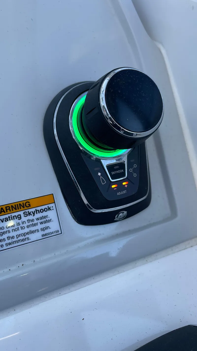 Slide: The Image of Evolve 400HT 2022 control panel with illuminated knob and warning label. - 14