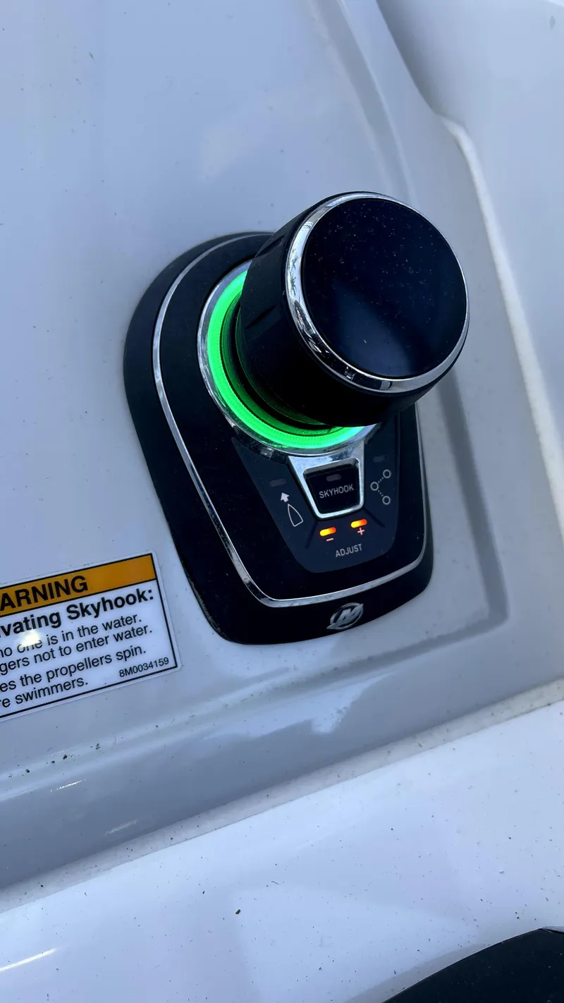 Slide: The Image of Evolve 400HT 2022 control panel with illuminated knob and warning label. - 4