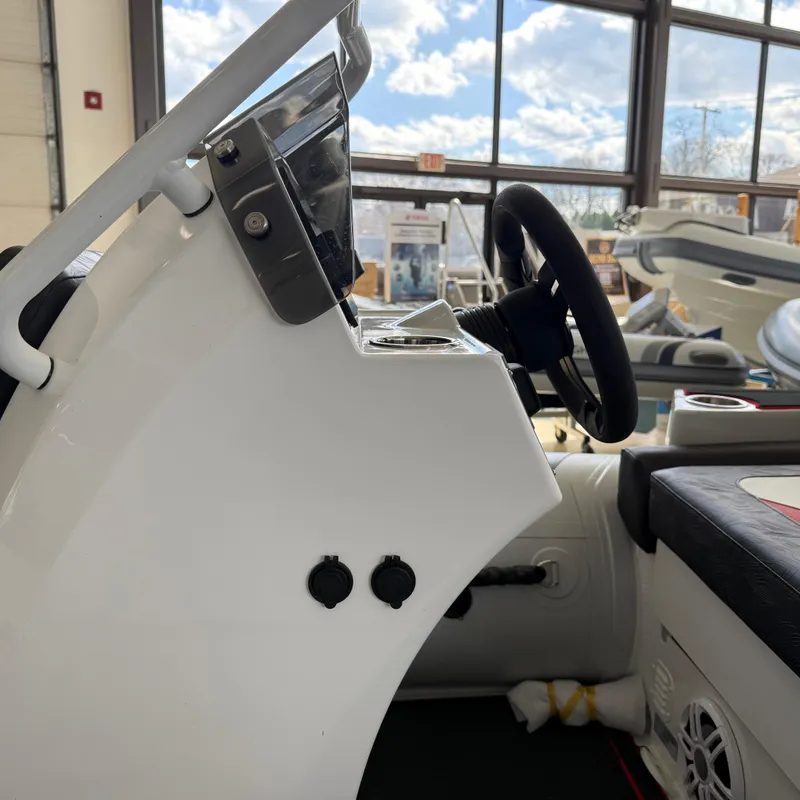 Slide: The Image of 2025 Highfield 420 Velox boat interior with steering wheel and control panel. - 12
