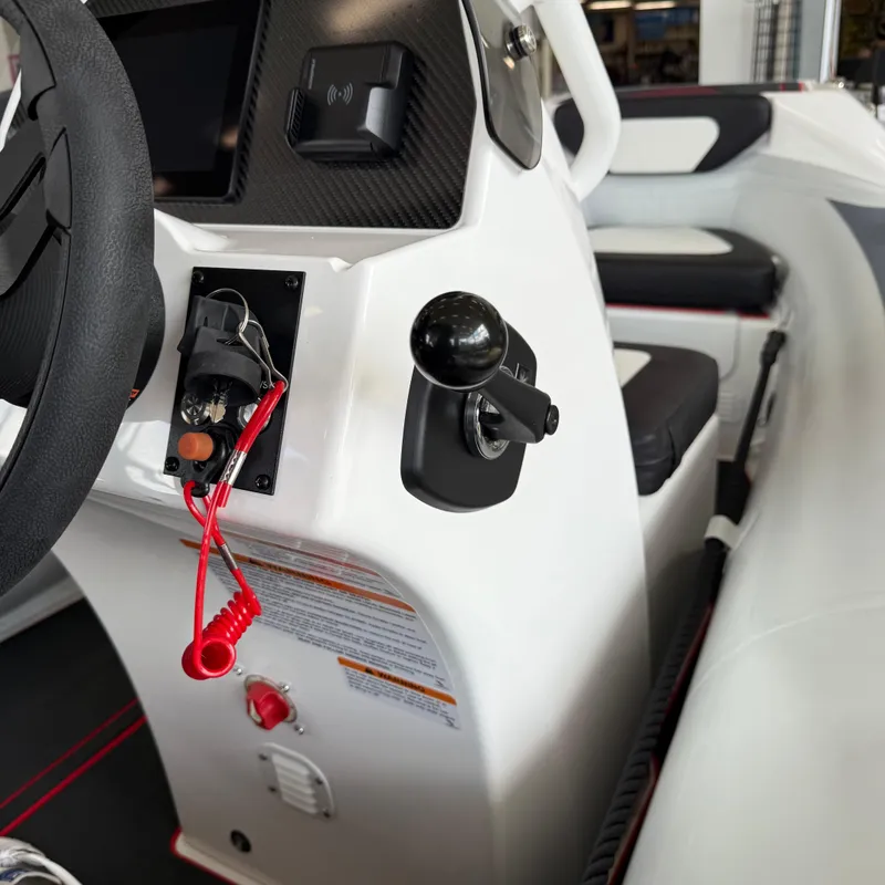 Slide: The Image of Interior view of 2025 Highfield 420 Velox boat cockpit with steering wheel and controls. - 15