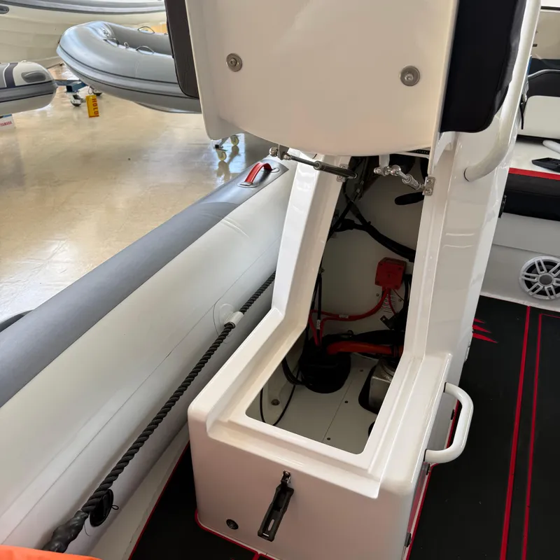 Slide: The Image of 2025 Highfield 420 Velox boat interior showing storage compartment and seating. - 17