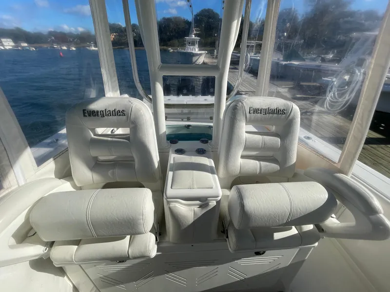 Slide: The Image of 2008 Everglades 350CC boat interior with white seating and clear windows. - 10