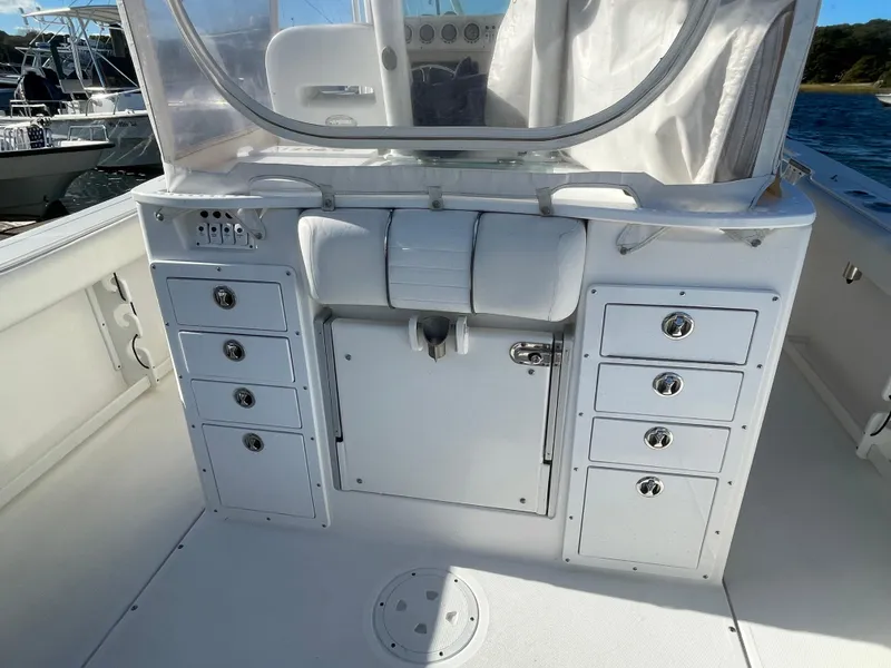 Slide: The Image of 2008 Everglades 350CC boat interior with storage compartments and seating. - 11