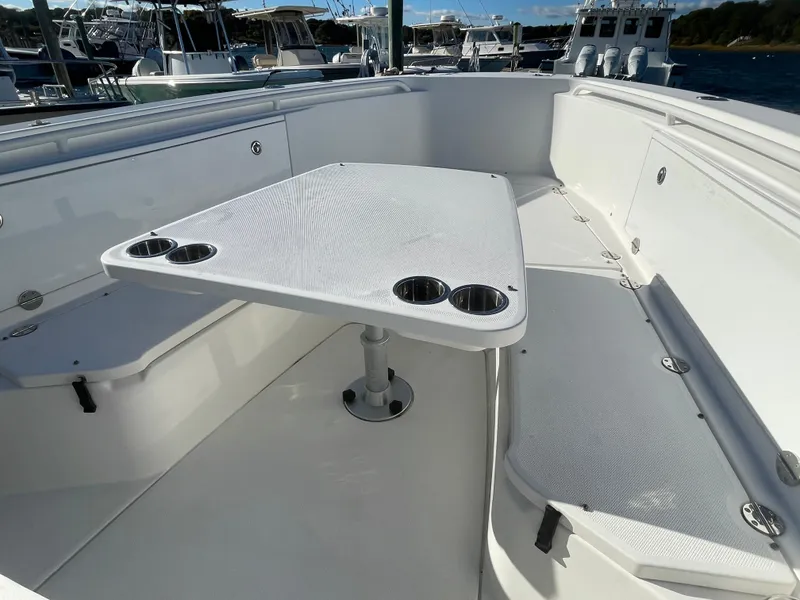Slide: The Image of 2008 Everglades 350CC boat interior with table and seating area. - 19
