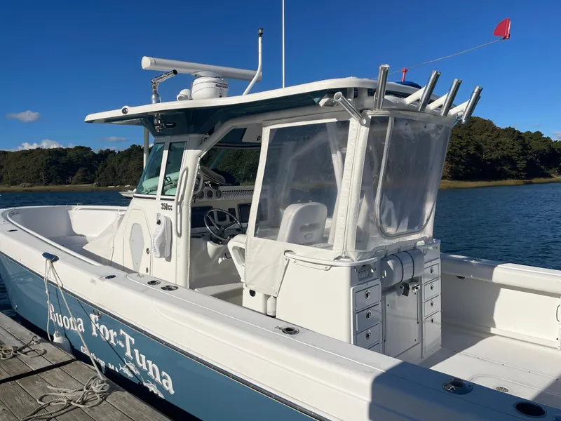Slide: The Image of 2008 Everglades 350CC boat docked on a sunny day, featuring a sleek design. - 3