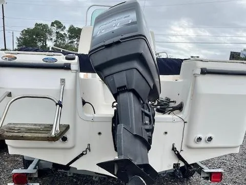Slide: The Image of 1998 Bayliner Trophy 1903 CC boat with outboard motor, rear view. - 4