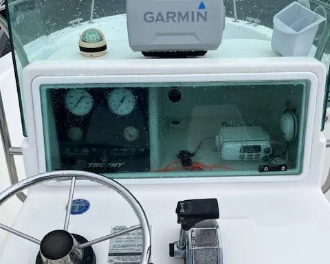 Slide: The Image of 1998 Bayliner Trophy 1903 CC boat dashboard with Garmin GPS and navigation instruments. - 5