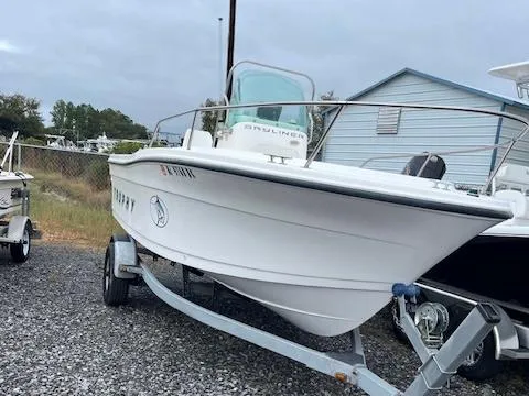 Slide: The Image of 1998 Bayliner Trophy 1903 CC boat on trailer, parked outdoors. - 6