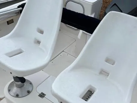 Slide: The Image of White seats on a 1998 Bayliner Trophy 1903 CC boat deck. - 9