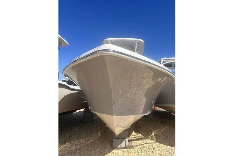 Slide: The Image of 2025 Key West 239 FS boat, front view under clear blue sky. - 16