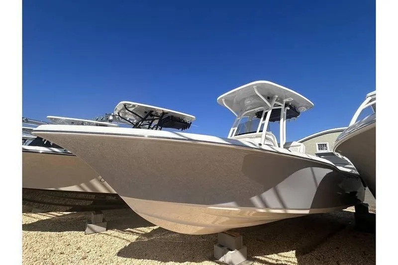 Slide: The Image of 2025 Key West 239 FS boat displayed outdoors under clear blue sky. - 17