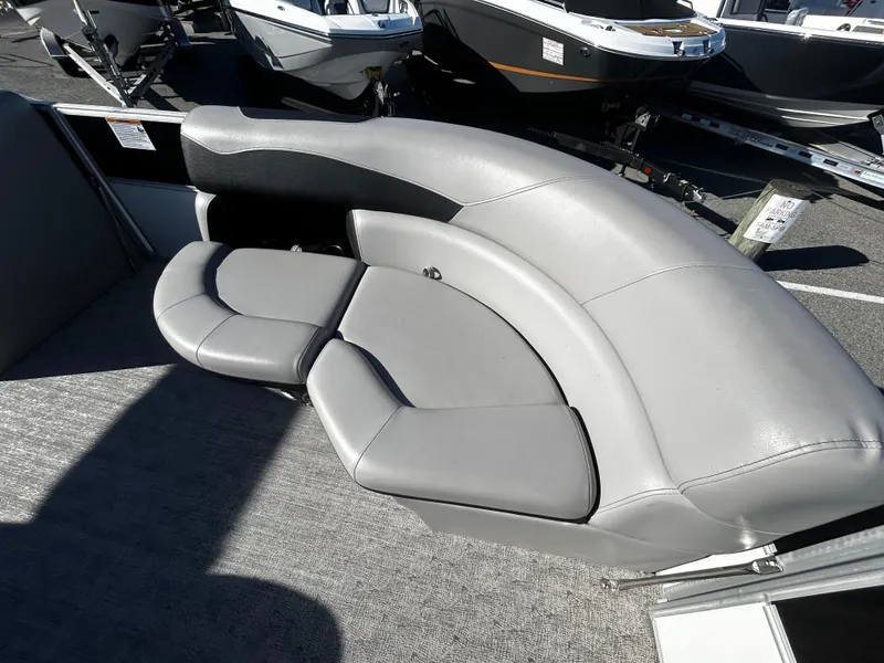 Slide: The Image of 2024 Berkshire 24RFC LE 2.75 boat with sleek gray seating. - 10