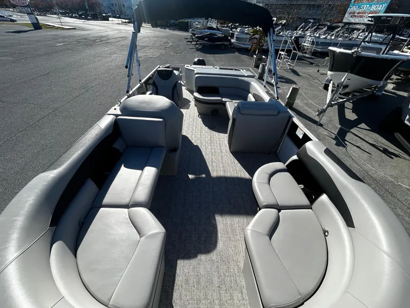 Slide: The Image of 2024 Berkshire 24RFC LE 2.75 pontoon boat with spacious seating and modern design. - 14