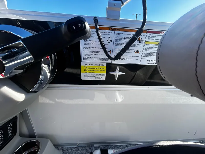 Slide: The Image of 2024 Berkshire 24RFC LE 2.75 boat dashboard with controls and safety instructions. - 17