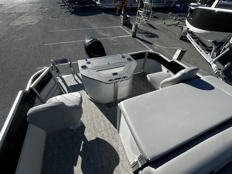 Slide: The Image of 2024 Berkshire 24RFC LE 2.75 pontoon boat interior with seating and helm. - 6