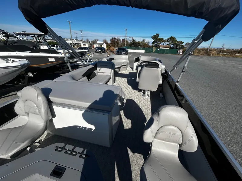 Slide: The Image of 2024 Berkshire 24RFC LE 2.75 pontoon boat with spacious seating and modern design. - 8