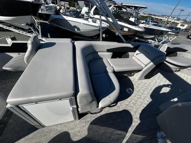 Slide: The Image of 2024 Berkshire 24RFC LE 2.75 pontoon boat with luxurious seating and modern design. - 9