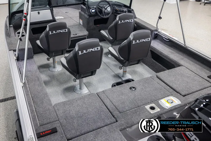 Slide: The Image of 2025 Lund 1875 Impact XS boat interior with four seats and steering console. - 10