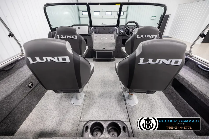 Slide: The Image of 2025 Lund 1875 Impact XS boat interior with four seats and steering console. - 12