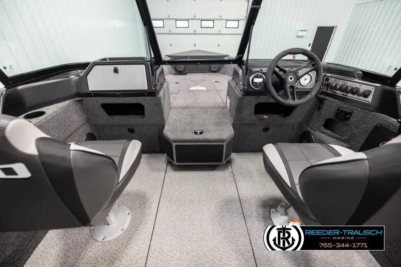 Slide: The Image of Interior of 2025 Lund 1875 Impact XS boat with modern seating and dashboard. - 13