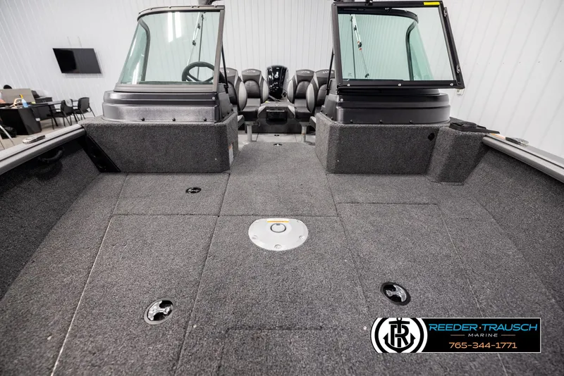 Slide: The Image of 2025 Lund 1875 Impact XS boat interior with spacious deck and seating. - 15