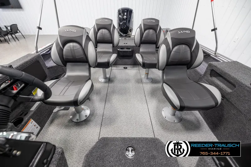 Slide: The Image of 2025 Lund 1875 Impact XS boat interior with four cushioned seats. - 16