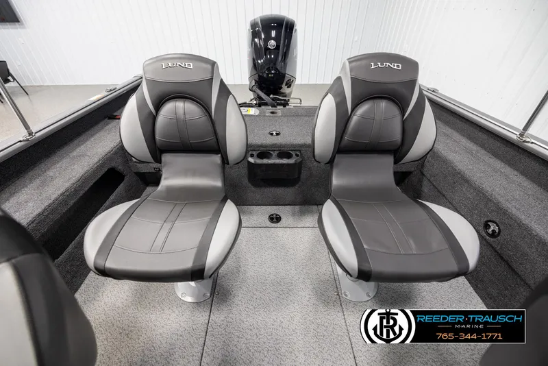 Slide: The Image of 2025 Lund 1875 Impact XS boat interior with two black and gray seats. - 17