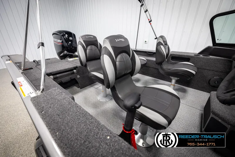 Slide: The Image of 2025 Lund 1875 Impact XS boat interior with seating and Mercury engine. - 18