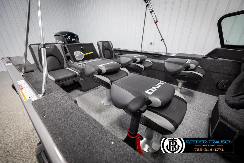 Slide: The Image of 2025 Lund 1875 Impact XS boat interior with seating and fishing gear. - 20