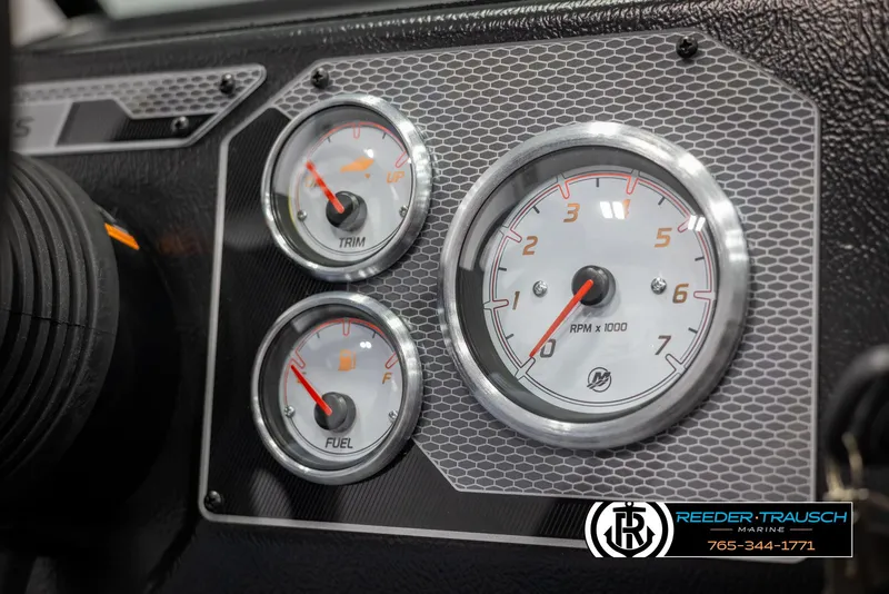 Slide: The Image of Dashboard gauges of 2025 Lund 1875 Impact XS boat, featuring RPM, trim, and fuel indicators. - 27