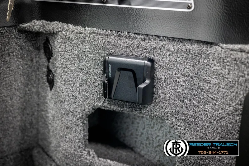 Slide: The Image of 2025 Lund 1875 Impact XS interior detail with carpeted finish and mounted accessory. - 29