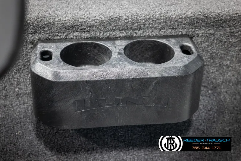 Slide: The Image of 2025 Lund 1875 Impact XS boat cup holder, black plastic, mounted on carpeted surface. - 36