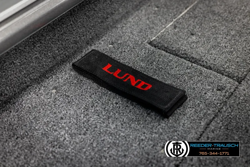 Slide: The Image of 2025 Lund 1875 Impact XS boat interior with logo detail. - 37