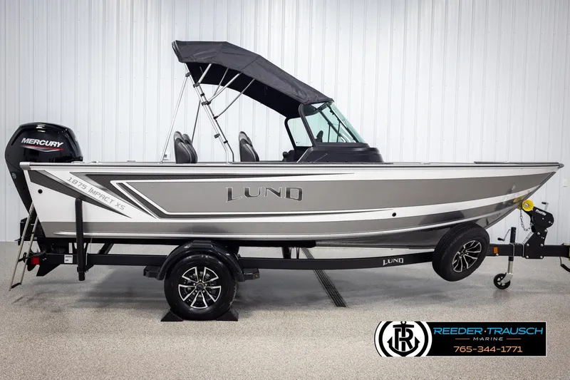 Slide: The Image of 2025 Lund 1875 Impact XS boat with Mercury engine on trailer. - 4