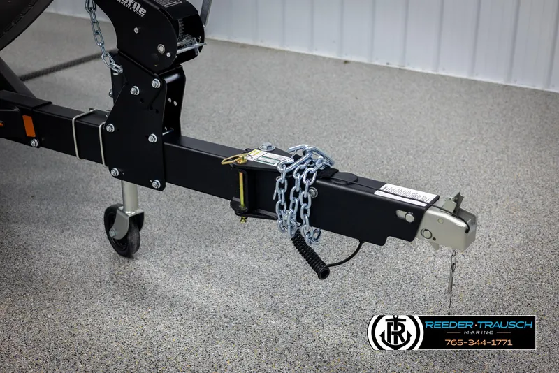 Slide: The Image of Trailer hitch of 2025 Lund 1875 Impact XS with safety chains and lock. - 46