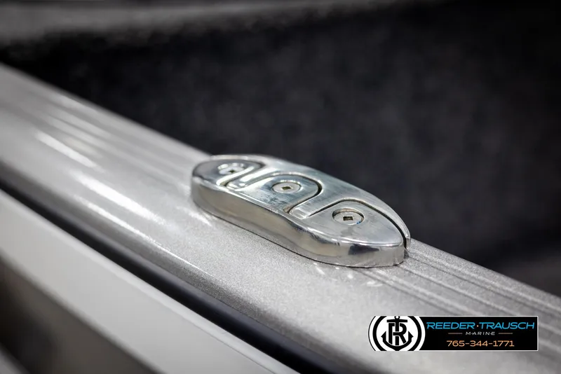 Slide: The Image of Close-up of 2025 Lund 1875 Impact XS boat cleat, featuring sleek metal design. - 48