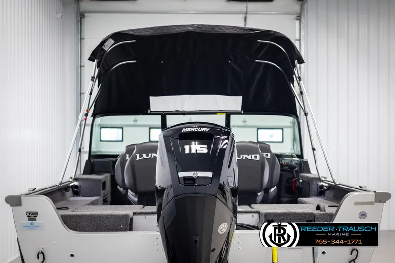 Slide: The Image of 2025 Lund 1875 Impact XS boat with Mercury 115 engine in showroom. - 6