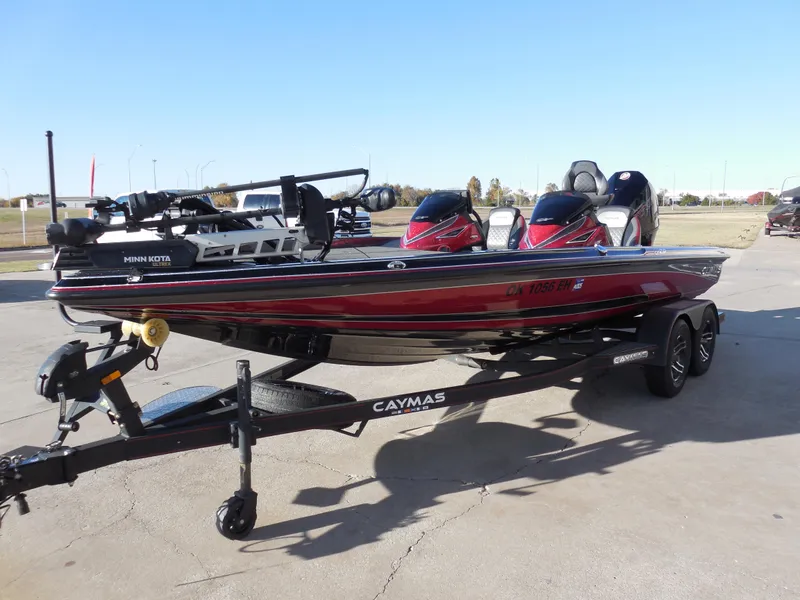 Slide: The Image of 2021 Caymas CX 20 PRO bass boat on trailer, featuring sleek red and black design. - 5