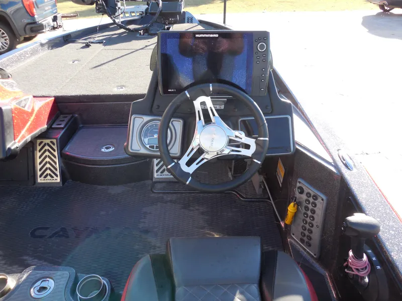 Slide: The Image of 2021 Caymas CX 20 PRO boat dashboard with steering wheel and electronic display. - 7